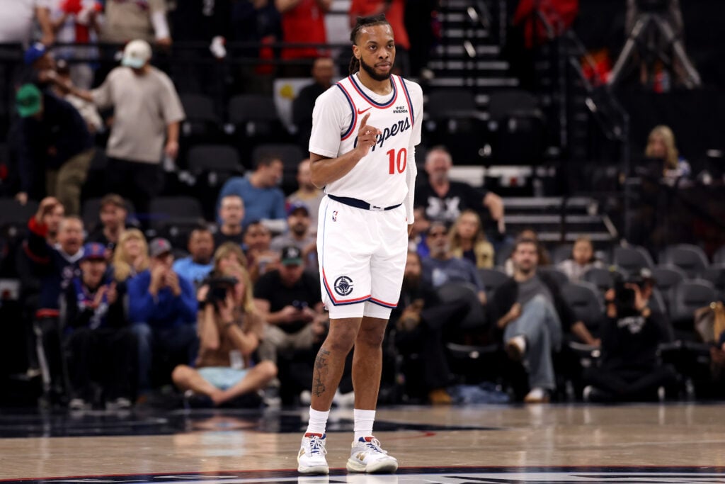 Darius Garland #10 of the Los Angeles Clippers reacts after a basket by a teammate during the first quarter of an NBA game against the Dallas Mavericks at Intuit Dome.