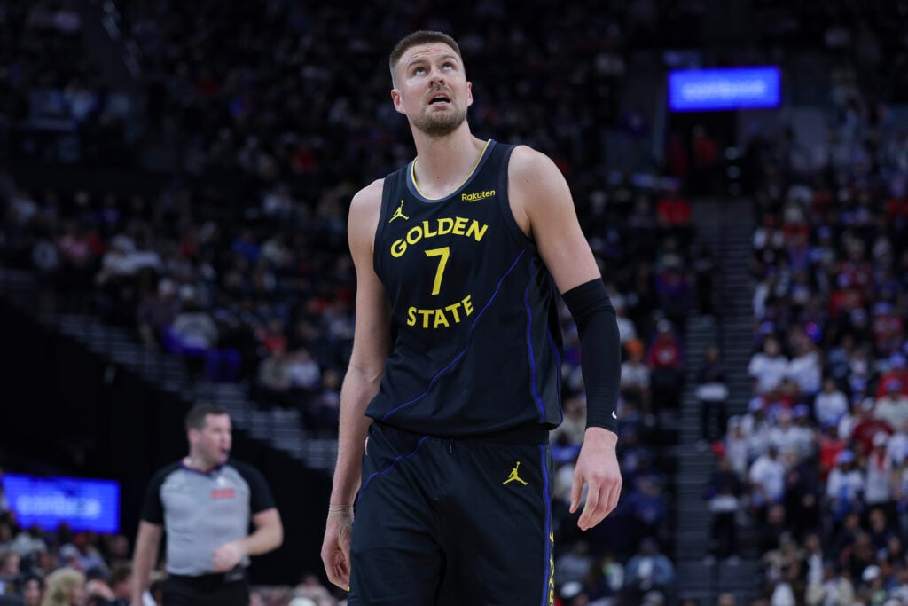 Kristaps Porzingis #7 of the Golden State Warriors walks on the court during the first half of an NBA game against the Los Angeles Clippers at Intuit Dome.