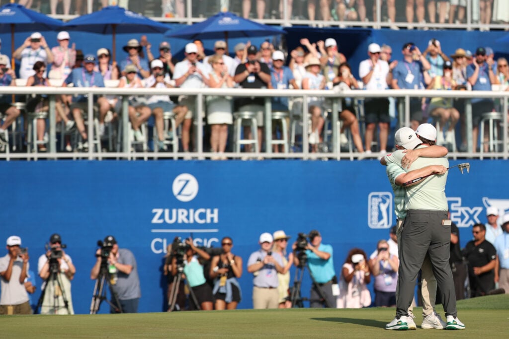 Alex Fitzpatrick (L) of England and Matt Fitzpatrick of England embrace on the 18th green after winning the Zurich Classic of New Orleans 2026 at TPC Louisiana