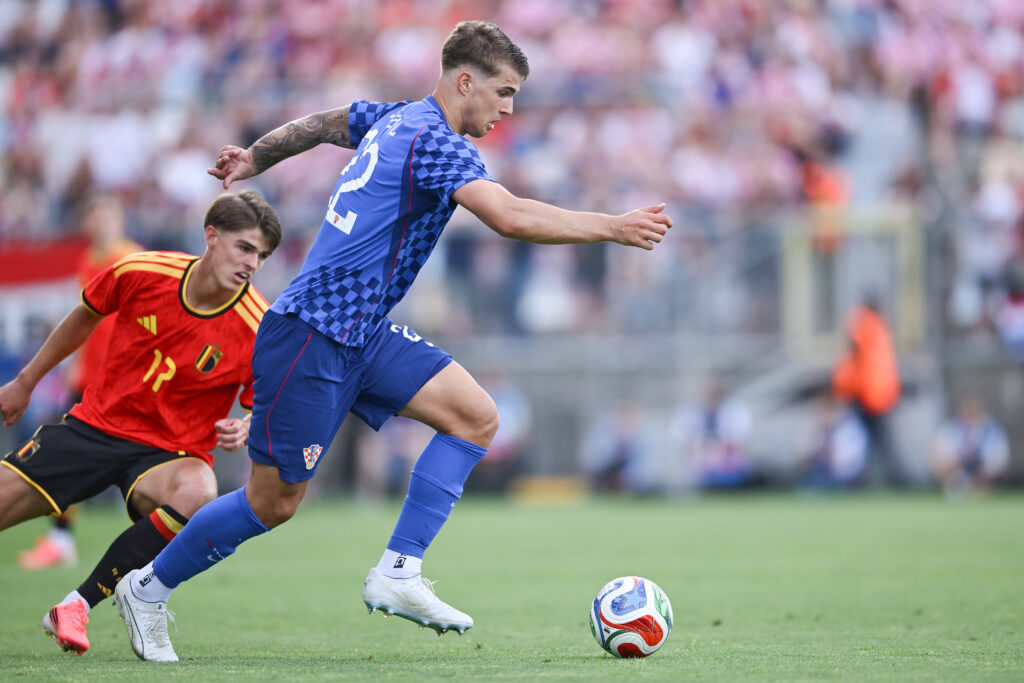 Charles De Ketelaere of Belgium and Luka Vuskovic of Croatia in action during the international friendly match between Croatia and Belgium