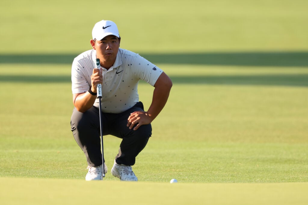 Tom Kim of South Korea lines up a putt on the second green during the second round of the Charles Schwab Challenge 2026 at Colonial Country Club