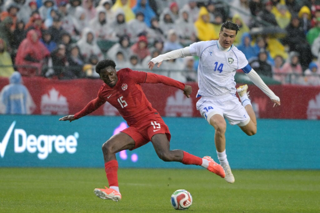 Moise Bombito of Canada, Eldor Shomurodov of Uzbekistan during the International Friendly match between Canada v Uzbekistan at the Commonwealth Stadium