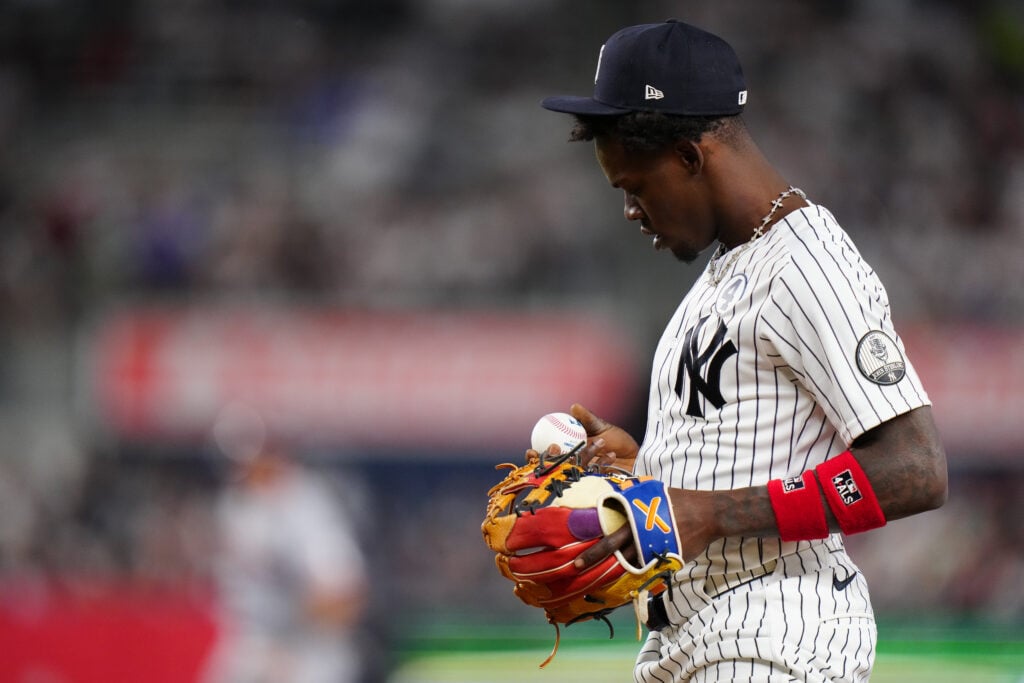 Jazz Chisholm Jr. #13 of the New York Yankees looks at a baseball in the eighth inning during the game between the Cleveland Guardians and the New York Yankees at Yankee Stadium on Tuesday, June 2, 2026 in New York, New York.