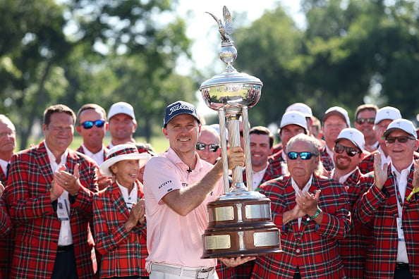 Russell Henley of the United States holds the winner's trophy after winning the the Charles Schwab Challenge 2026 at Colonial Country Club