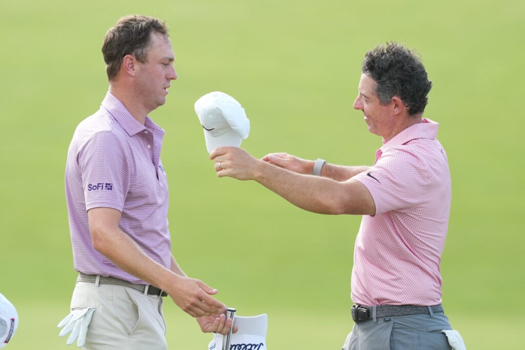 Justin Thomas and Rory McIlroy on the 18th green after the second round of the Memorial Tournament at Muirfield Village