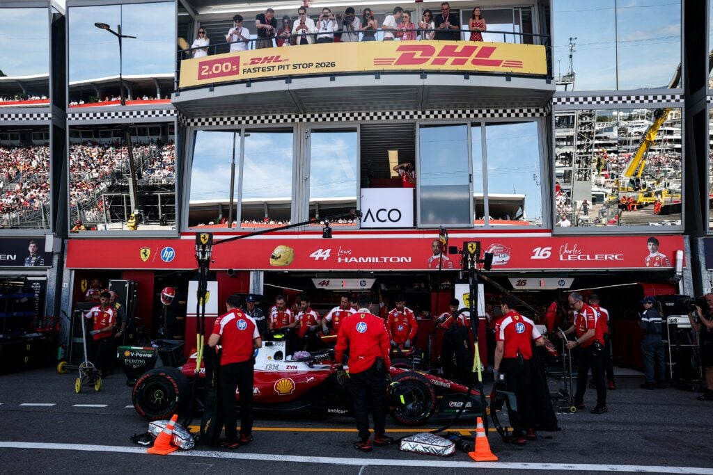 US reality TV personality Kim Kardashian (up C) watches as Ferrari's British driver Lewis Hamilton prepares to leave the garage to compete in the qualifying session at the Monaco street circuit in Monaco, ahead of the Monaco Formula 1 Grand Prix, on June 6, 2026.
