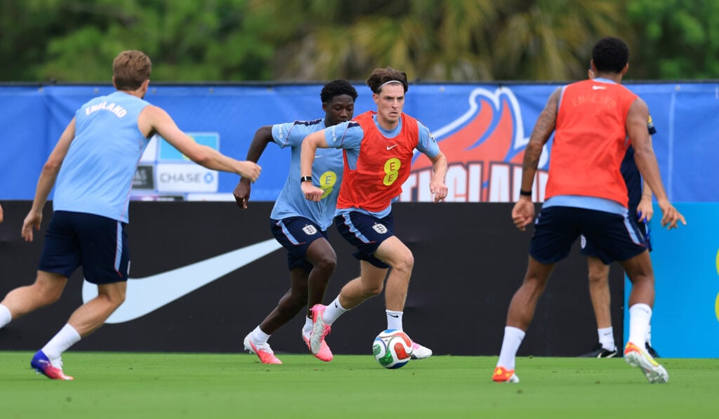 Alex Scott of England runs with the ball during a training session