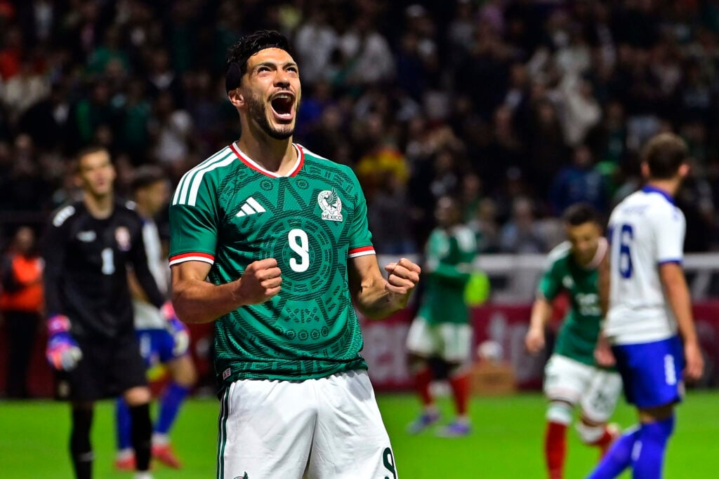 Raul Jimenez celebrates after scoring for Mexico vs Serbia.