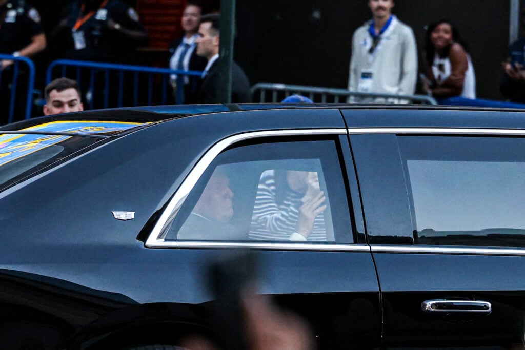 US President Donald Trump waves to fans as he arrives at Madison Square Garden ahead of NBA Finals game 3 between the New York Knicks and the San Antonio Spurs.