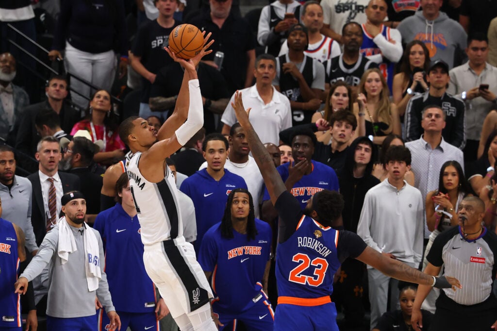 Victor Wembanyama #1 of the San Antonio Spurs shoots the ball against Mitchell Robinson #23 of the New York Knicks during the fourth quarter in Game Two of the 2026 NBA Finals at Frost Bank Center on June 05, 2026 in San Antonio, Texas.