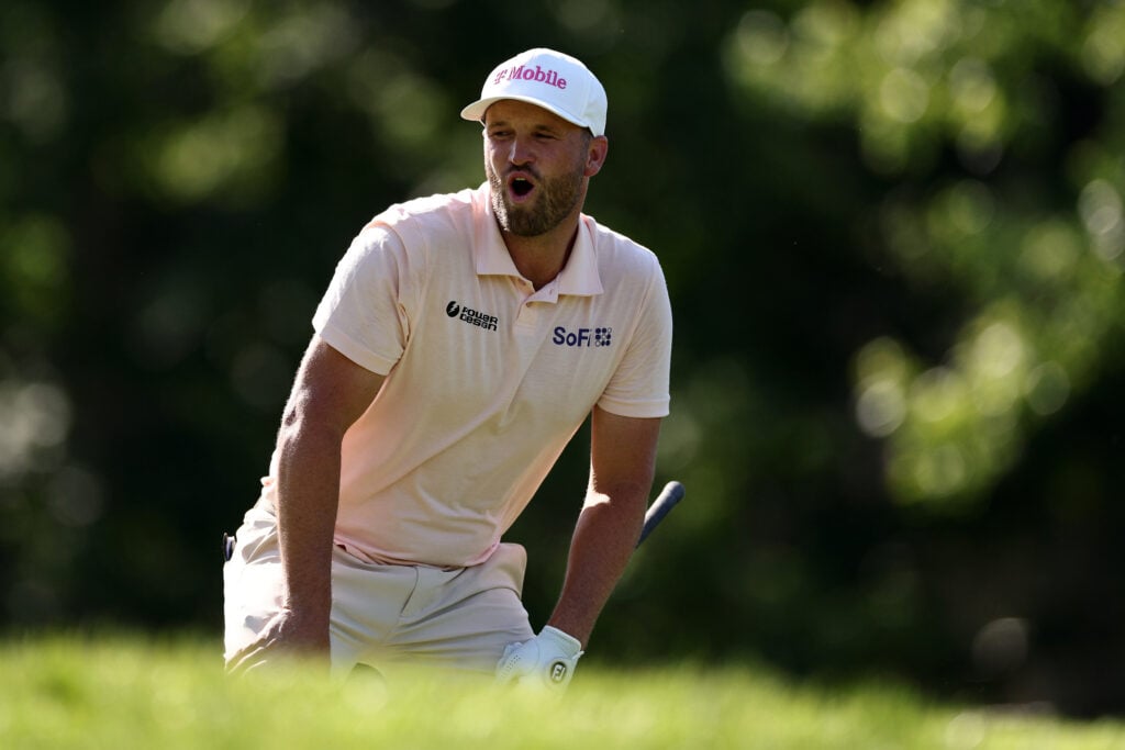 Wyndham Clark reacts to his tee shot during the final round of the Memorial Tournament