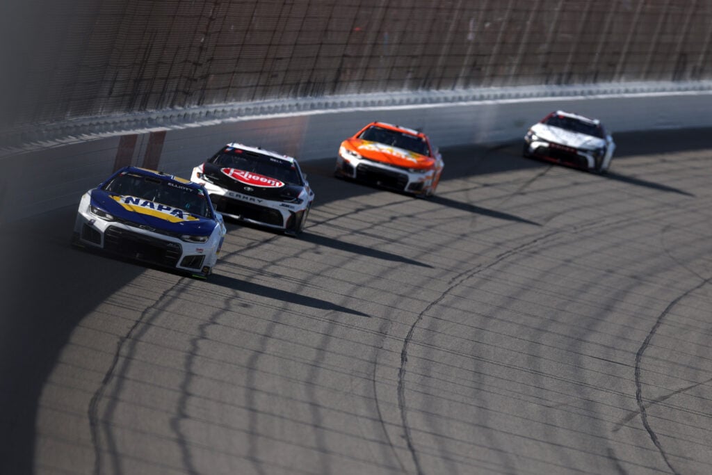 Chase Elliott, driver of the #9 NAPA Auto Parts Chevrolet, and Christopher Bell, driver of the #20 Rheem Toyota, race during the NASCAR Cup Series FireKeepers Casino 400 at Michigan International Speedway on June 07, 2026 in Brooklyn, Michigan.
