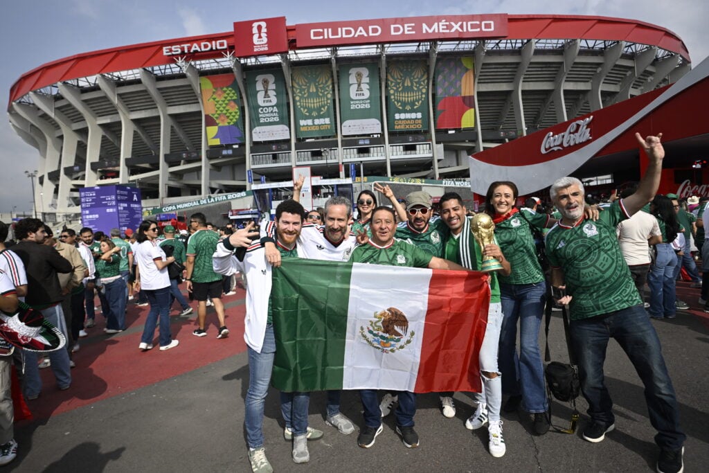 Mexico supporters pose outisde the stadium ahead of the 2026 World Cup Group A football match between Mexico and South Africa at the Mexico City Stadium in Mexico City