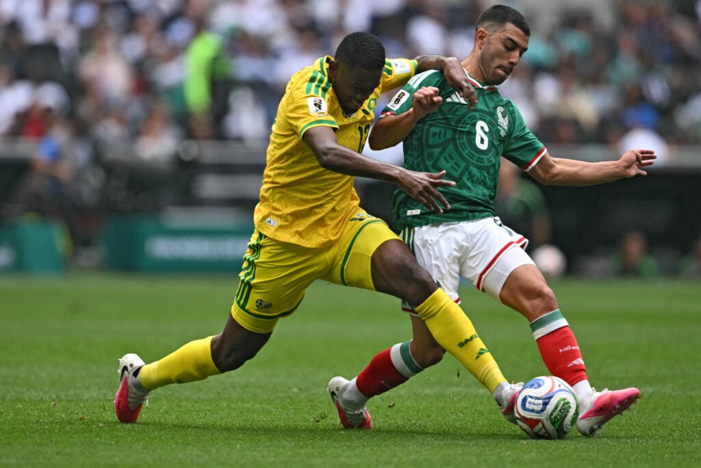 South Africa's midfielder #13 Sphephelo Sithole and Mexico's midfielder #06 Erik Lira fight for the ball during the 2026 World Cup Group A football match between Mexico and South Africa at the Mexico City Stadium in Mexico City on June 11, 2026.
