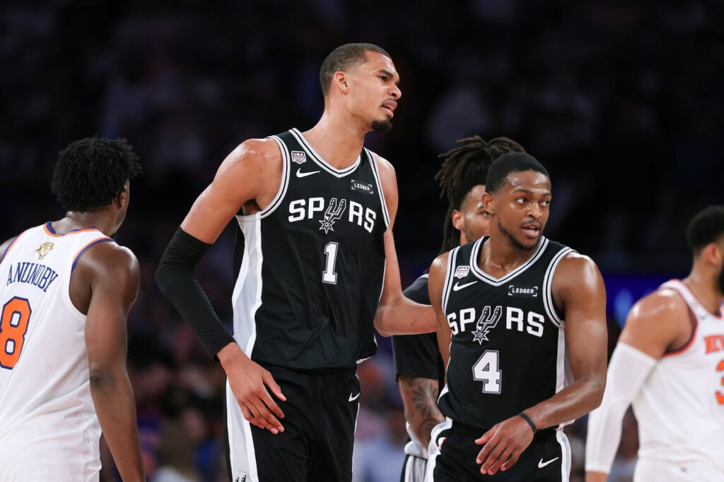 Victor Wembanyama #1 of the San Antonio Spurs and De'aaron Fox #4 of the San Antonio Spurs react during the fourth quarter against the New York Knicks in Game Three of the 2026 NBA Finals at Madison Square Garden.