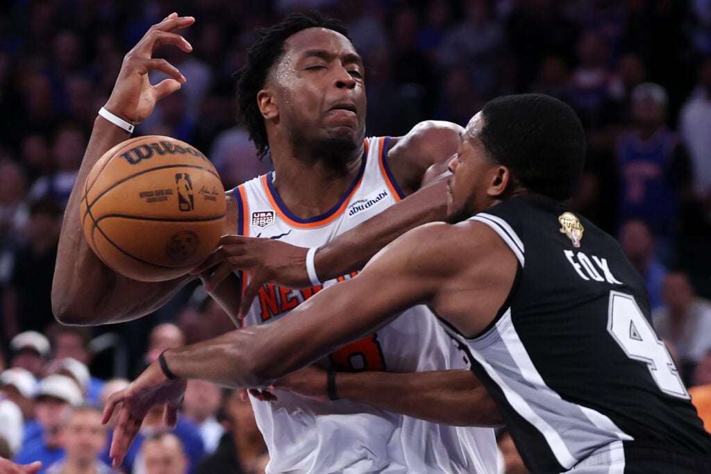 De'aaron Fox #4 of the San Antonio Spurs knocks the ball away from OG Anunoby #8 of the New York Knicks during the third quarter in Game Four of the 2026 NBA Finals at Madison Square Garden.