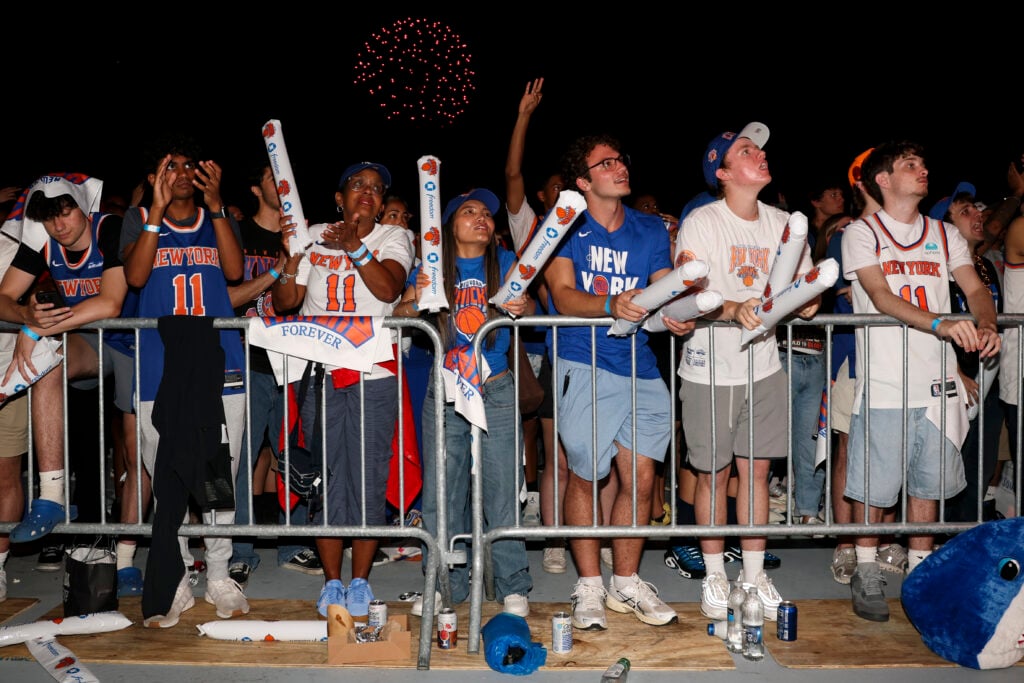 Fans cheer at the Knicks watch party at Wollman Rink in Central Park for Game 4 of the NBA Finals between the San Antonio Spurs and New York Knicks.