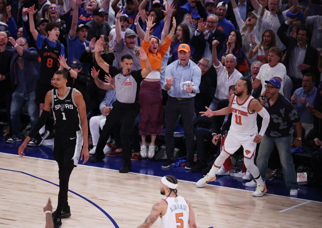 Jalen Brunson #11 of the New York Knicks reacts after making a three point shot in the fourth quarter as Victor Wembanyama #1 of the San Antonio Spurs looks on in Game Four of the 2026 NBA Finals at Madison Square Garden on June 10, 2026 in New York City.