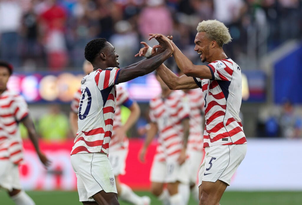 Folarin Balogun #20 of the United States celebrates scoring his team's second goal with Antonee Robinson #5 during the FIFA World Cup 2026 Group D match between USA and Paraguay at Los Angeles Stadium on June 12, 2026 in Los Angeles, California.