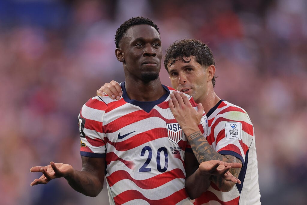 Folarin Balogun #20 of the United States celebrates scoring his team's third goal with Christian Pulisic #10 during the FIFA World Cup 2026 Group D match between USA and Paraguay at Los Angeles Stadium