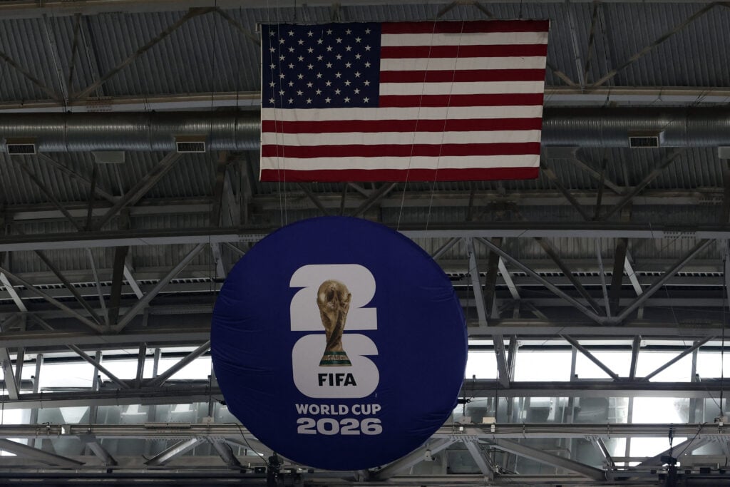 A FIFA World Cup 2026 logo is displayed next to a United States flag in the stadium during the 2026 World Cup Group L football match between England and Croatia