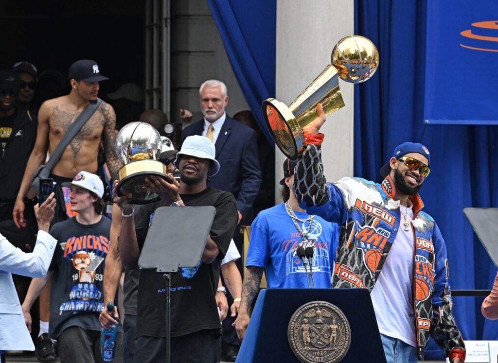 Karl Anthony Towns, Ariel Hukporti and Tyler Kolek are seen outside City Hall during the New York Knicks ticker-tape parade.