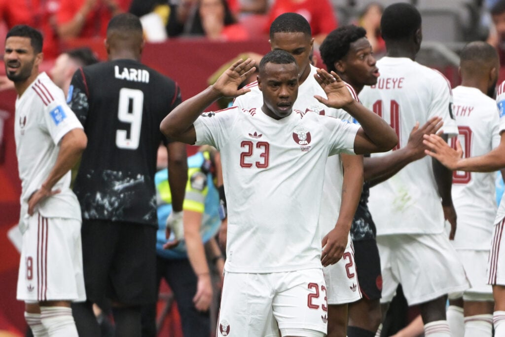 Assim Madibo of Qatar shocked after the injury to Ismael Kone of Canada during the World Cup match between Canada v Qatar at the Vancouver Stadium