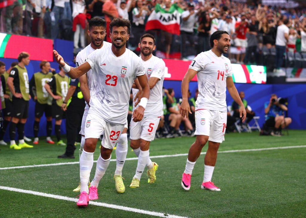 Ramin Rezaeian #23 of IR Iran celebrates with teammates after scoring his team's first goal during the FIFA World Cup 2026 Group G match between IR Iran and New Zealand at Los Angeles Stadium on June 15, 2026 in Inglewood, California.