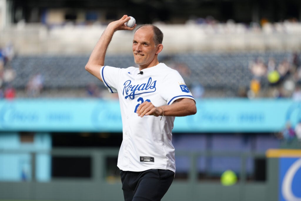 Thomas Tuchel, manager of England, practices throwing a ball prior to throwing out the ceremonial first pitch before the game between the St. Louis Cardinals and the Kansas City Royals