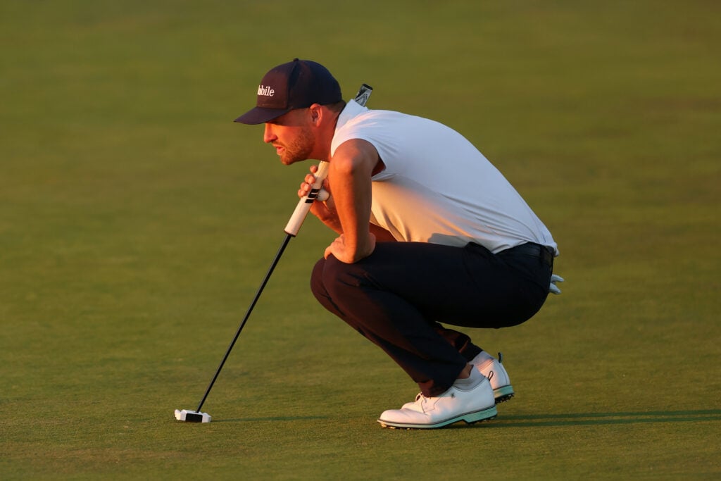 Wyndham Clark lines up a putt on the final hole during the third round of the US Open