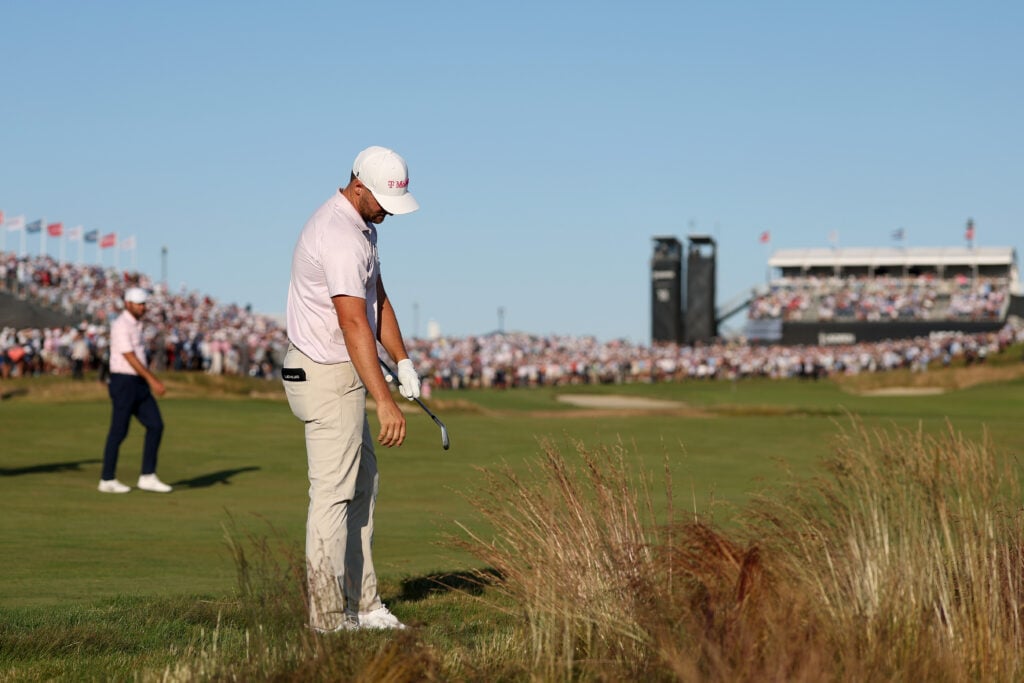 Wyndham Clark assesses his lie on the final hole during the last round of the US Open