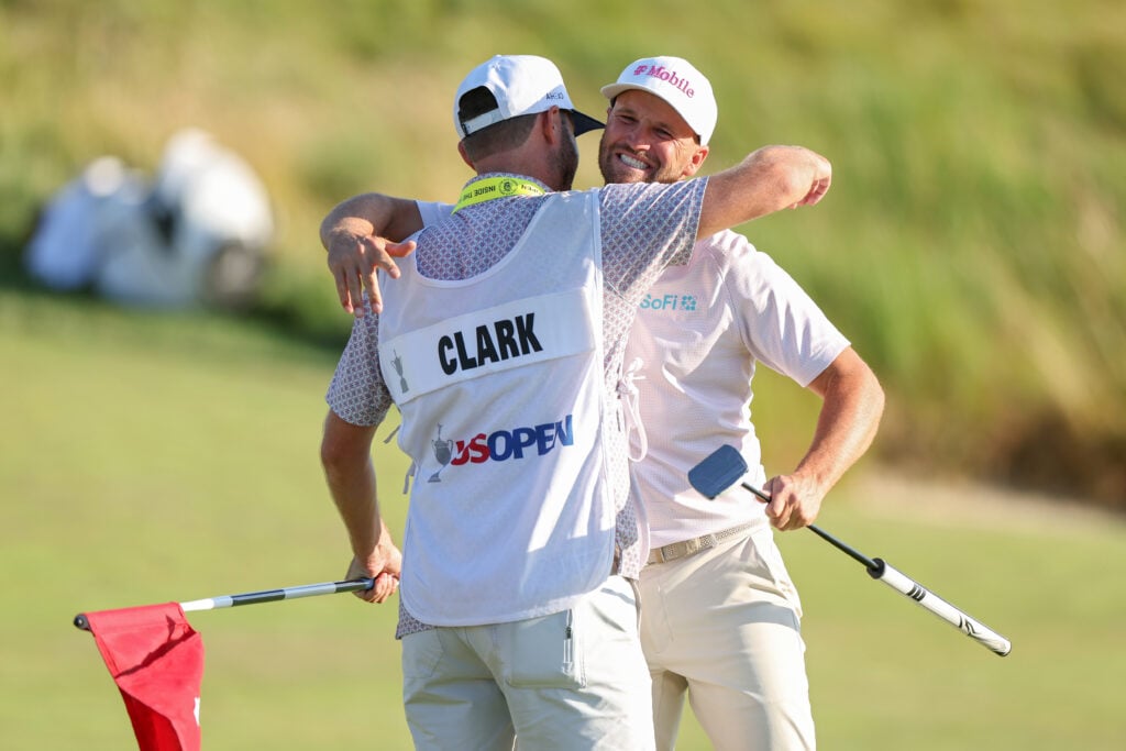 Wyndham Clark celebrates with caddie David Pelekoudas after winning the 126th U.S. OPEN at Shinnecock Hills
