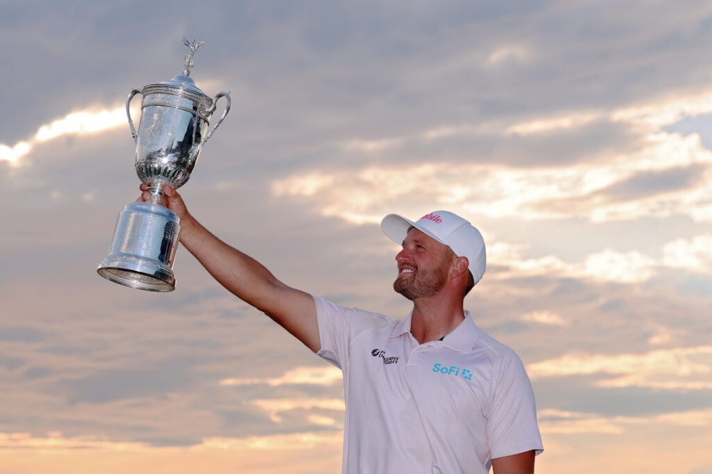 Wyndham Clark lifts the US Open trophy after his victory at Shinnecock Hills
