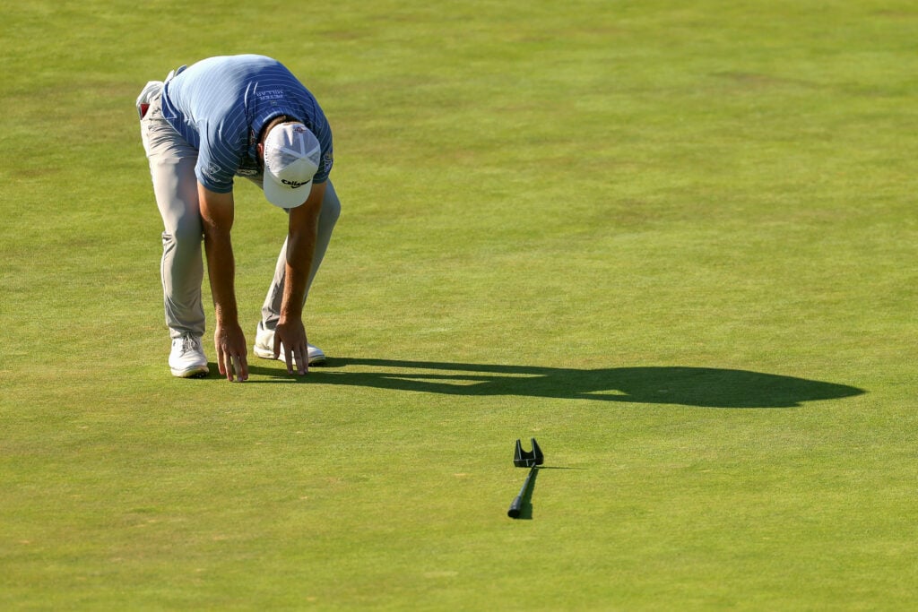 Sam Burns of the United States reacts after a putt on the 18th green during the final round of the 126th U.S. OPEN at Shinnecock Hills Golf Club