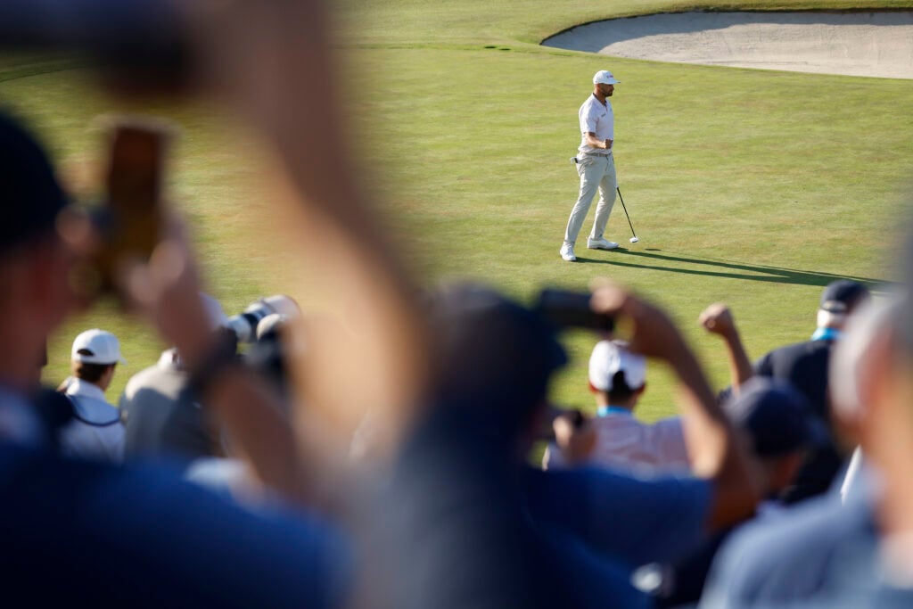 Wyndham Clark reacts to his putt on the final green of the US Open