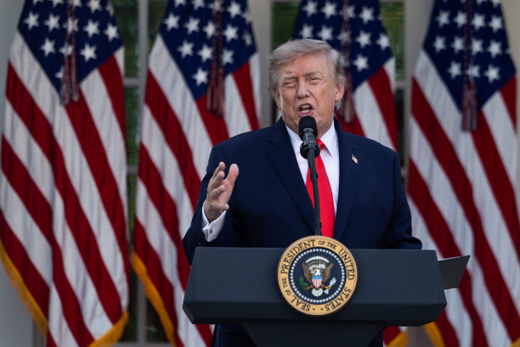 President Donald Trump speaks during a Rose Garden Club dinner at the White House.
