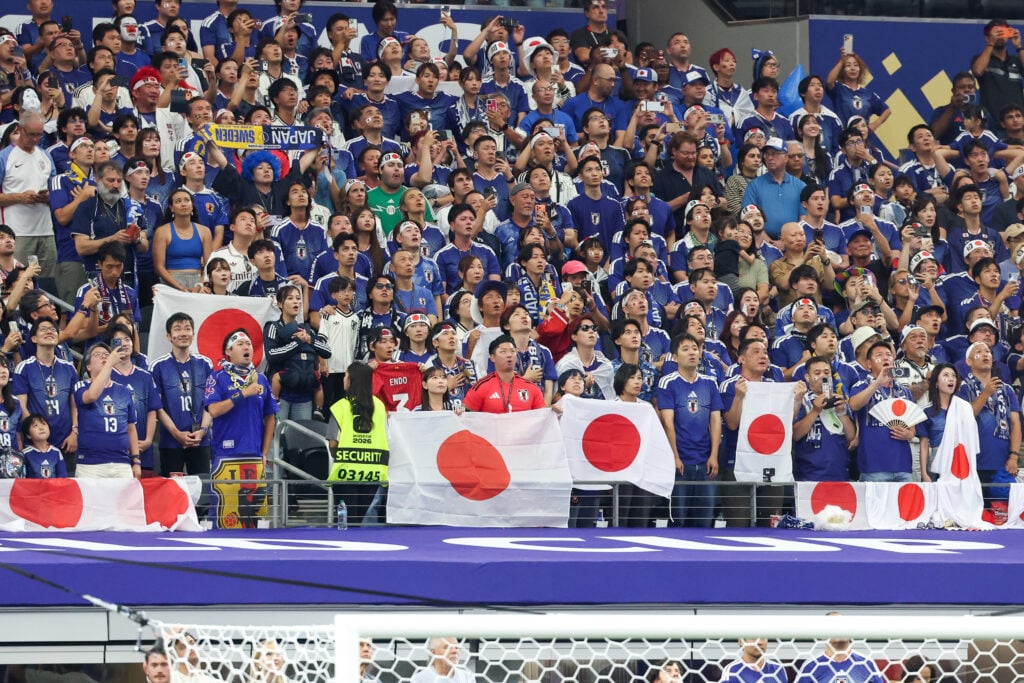Japan fans stand for their national anthem ahead of the FIFA World Cup 2026 Group F match between Japan and Sweden