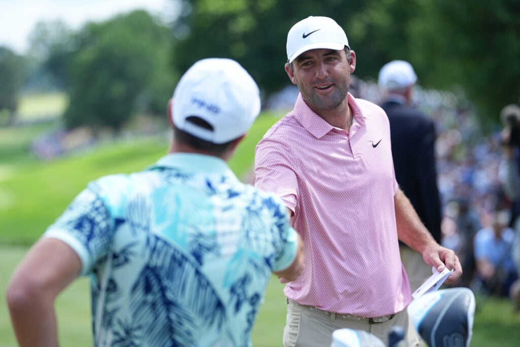 Scottie Scheffler and Viktor Hovland shake hands ahead of the final round of the Travelers Championship at TPC River Highlands