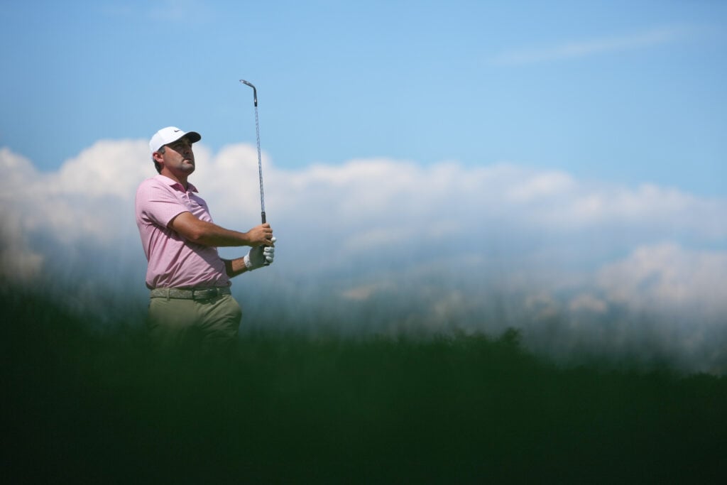 Scottie Scheffler hits an approach during the final round of the Travelers Championship