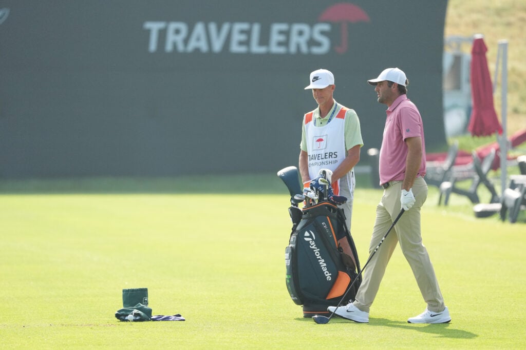 Scottie Scheffler practices on the range ahead of his playoff with Viktor Hovland at the Travelers Championship