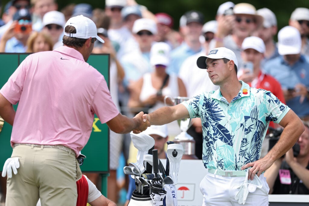 Scottie Scheffler and Viktor Hovland shake hands ahead of the final round of the Travelers Championship at TPC River Highlands