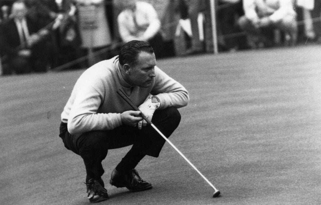 Billy Casper lines up a putt during the 1966 US Open