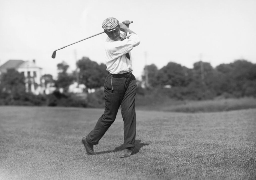 John Shippen Swinging Iron on Fairway