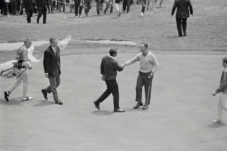 (Original Caption) Arnold Palmer congratulating his opponent, Billy Casper (right) just after the latter sank his final putt on the 18th green, to ...