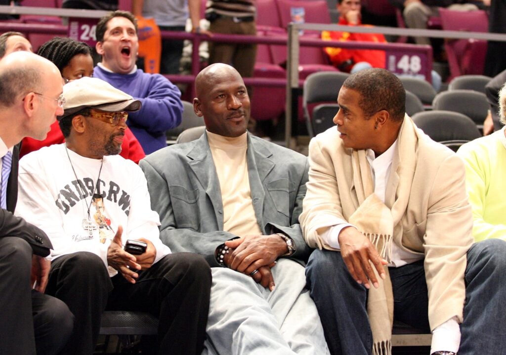 Spike Lee, Co-owner of the Charlotte Bobcats Michael Jordan and Ahmad Rashad talk courtside at the New York Knicks game against the Charlotte Bobcats November 5, 2008 at Madison Square Garden.