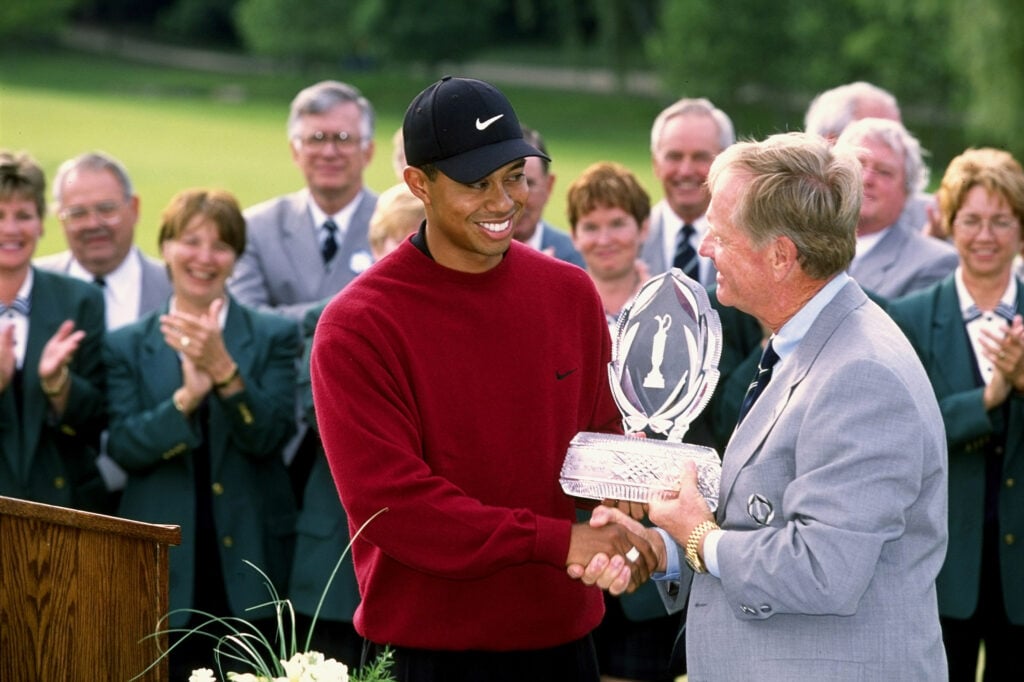 Jack Nicklaus presents Tiger Woods with the trophy after he wins the Memorial Tournament