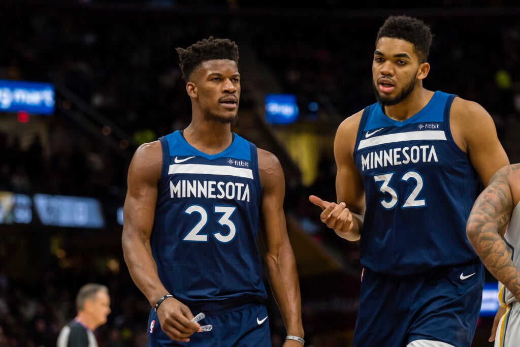 Jimmy Butler #23 talks with Karl-Anthony Towns #32 of the Minnesota Timberwolves during the first half against the Cleveland Cavaliers at Quicken Loans Arena.