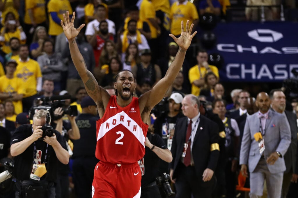 Kawhi Leonard #2 of the Toronto Raptors celebrates his teams win over the Golden State Warriors in Game Six to win the 2019 NBA Finals at ORACLE Arena