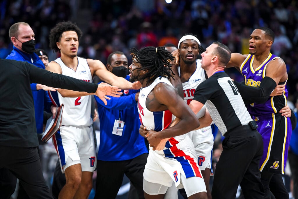 Isaiah Stewart #28 of the Detroit Pistons is restrained as he goes after LeBron James #6 of the Los Angeles Lakers during the third quarter of the game at Little Caesars Arena.