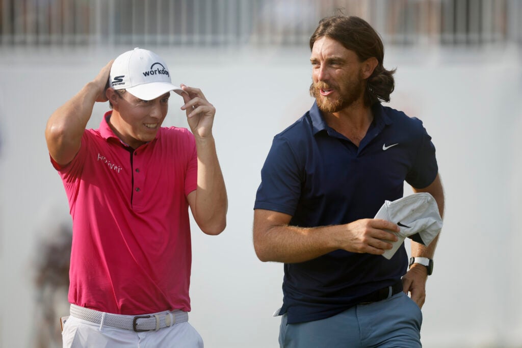 Matthew Fitzpatrick and Tommy Fleetwood after finishing on the 18th green during the final round of the TOUR Championship at East Lake
